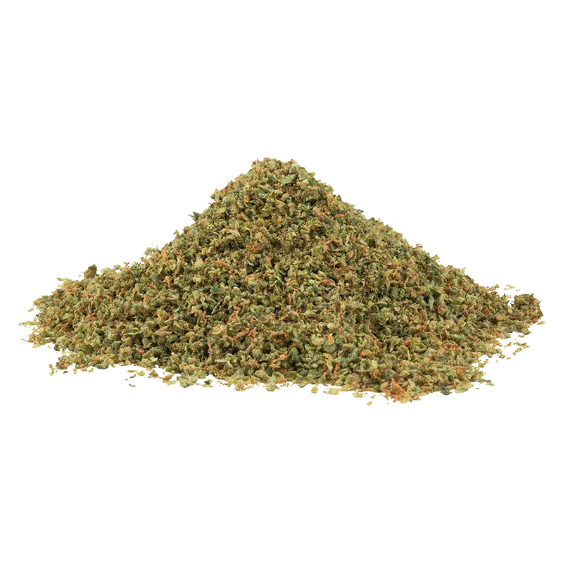 Pile of green and orange shredded herb photographed from front on a white background labeled Tropic Thunder.
