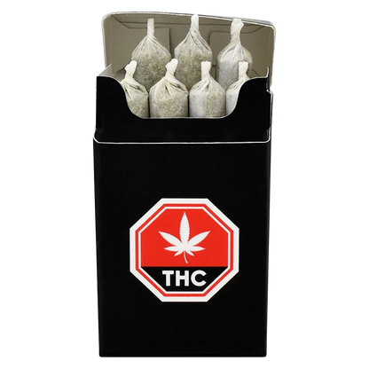 Top-down view of an open pack of Island Pink PR 7 x 0.5 g showing seven pre-rolled cones standing upright against a black pack with a red THC stop-sign logo.