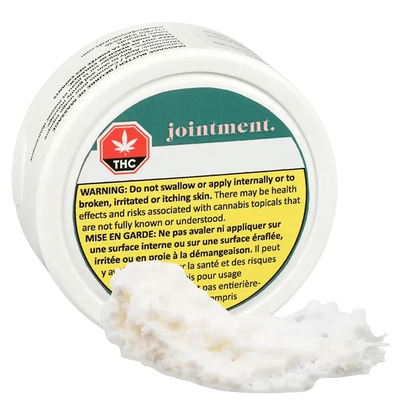 Close-up of the Jointoint packaging with a warning message in French, featuring a green and white design.