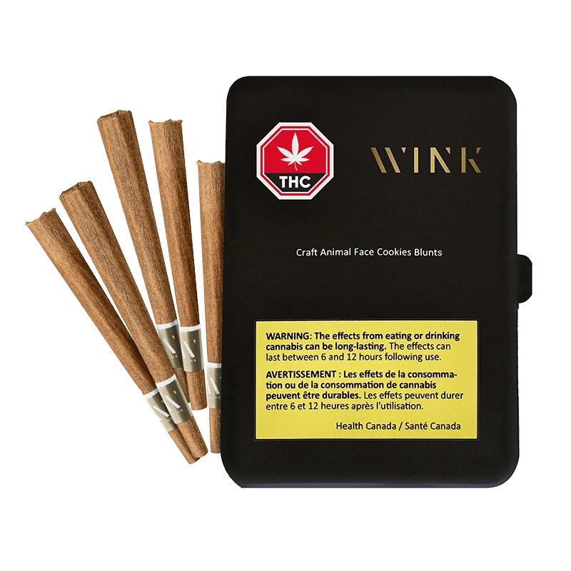 Angled top view of a black Wink Craft Animal Face Cookies PR 5 x 1 g tin with five brown prerolled blunts fanned beside it.