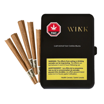 Angled top view of a black Wink Craft Animal Face Cookies PR 5 x 1 g tin with five brown prerolled blunts fanned beside it.