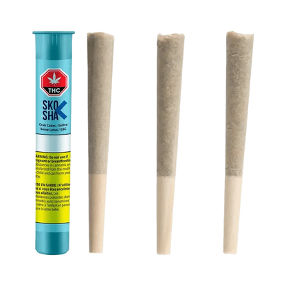 Close-up of the Crab Cakes Pre Rolled 3 x 0.5 g package with bold text against a dark background.