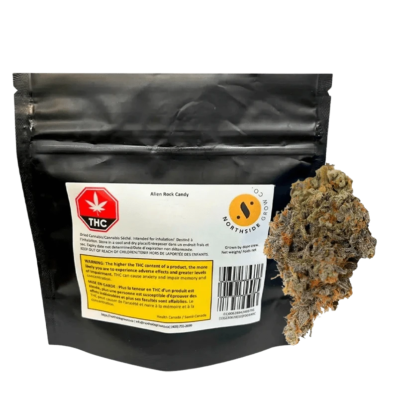 Front view of the Alien Rock Cndy package against a dark backdrop, showcasing the branding and French warning text on its label.