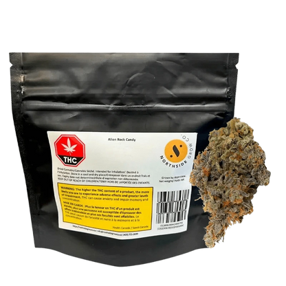 Front view of the Alien Rock Cndy package against a dark backdrop, showcasing the branding and French warning text on its label.