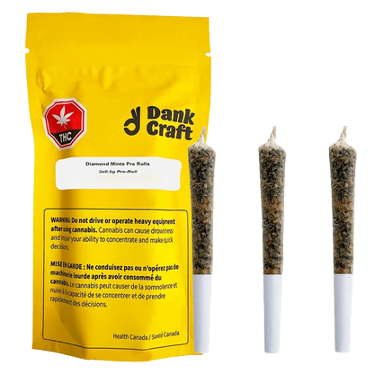 Close-up of the Diamond Mints Pre Rolled 3 x 0.5 g packaging with a cannabis leaf and bold branding, against a dark background.