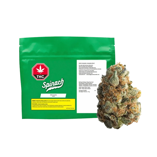 A close-up shot of the Spinach GMO Cookies package displaying bold text on a vibrant green background.