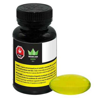 Front three-quarter view of a black bottle and a single yellow softgel labeled TIL Gems 10:0 Softgels Hybrid 100 caps - Redecan, on a white background