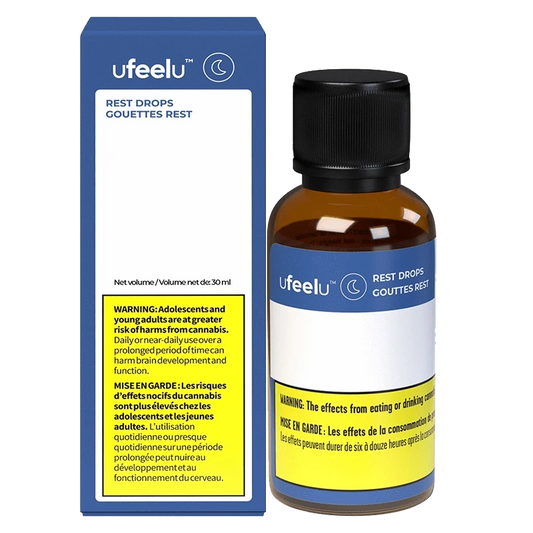 Ufeel Rest Drops (CBD:CBN) packaging is shown in a close-up, angled shot with a dark background, featuring bold text and branding.