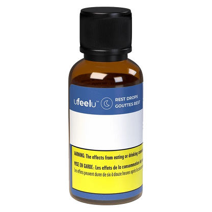 A close-up of the Rest Drops (CBD:CBN) bottle, displaying its label against a neutral background.