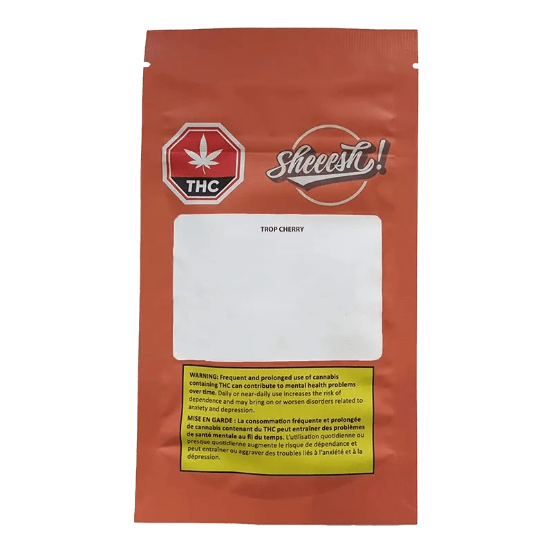 Front view of the Trop Cherry package with a warning message and cannabis leaf design against a bright orange background.