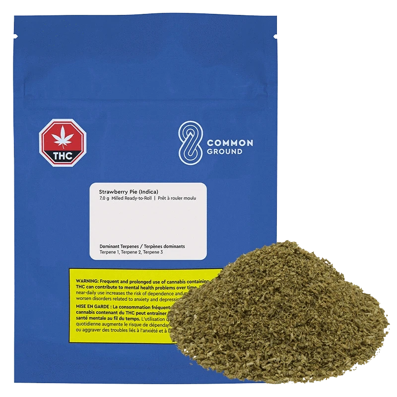 Close-up of the Strawberry Pie Milled Ready to Roll packaging against a black background, displaying warnings and product details.