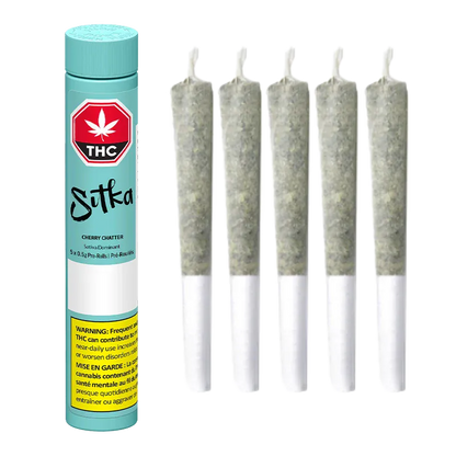 Cylinder of Cherry Chatter PR 5 x 0.5 g by Sitka standing left of five upright pre-rolled joints on a white background.