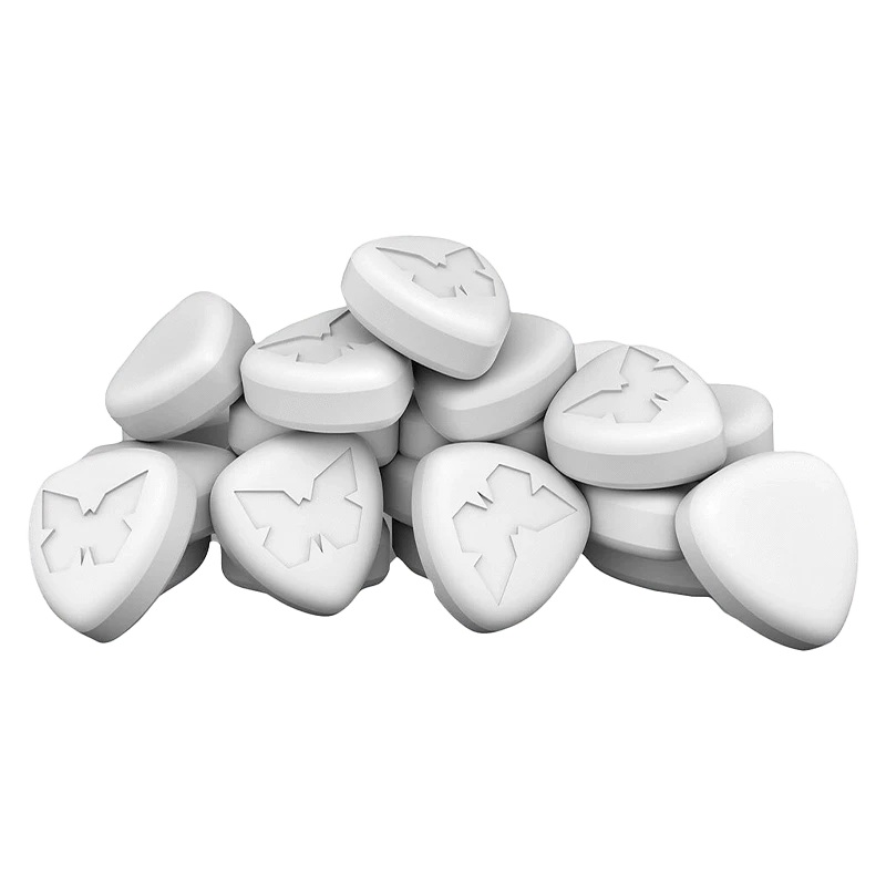 A top-down view of the Halo Lift 3:1 CBG/THC capsules, displaying their small, white, oblong shape in a scattered arrangement.