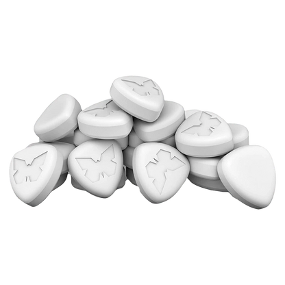 A top-down view of the Halo Lift 3:1 CBG/THC capsules, displaying their small, white, oblong shape in a scattered arrangement.