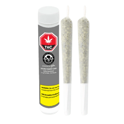 A close-up shot of two Double Baked Cake Pre Rolled 2 x 1 g pre-rolls against a plain white background.