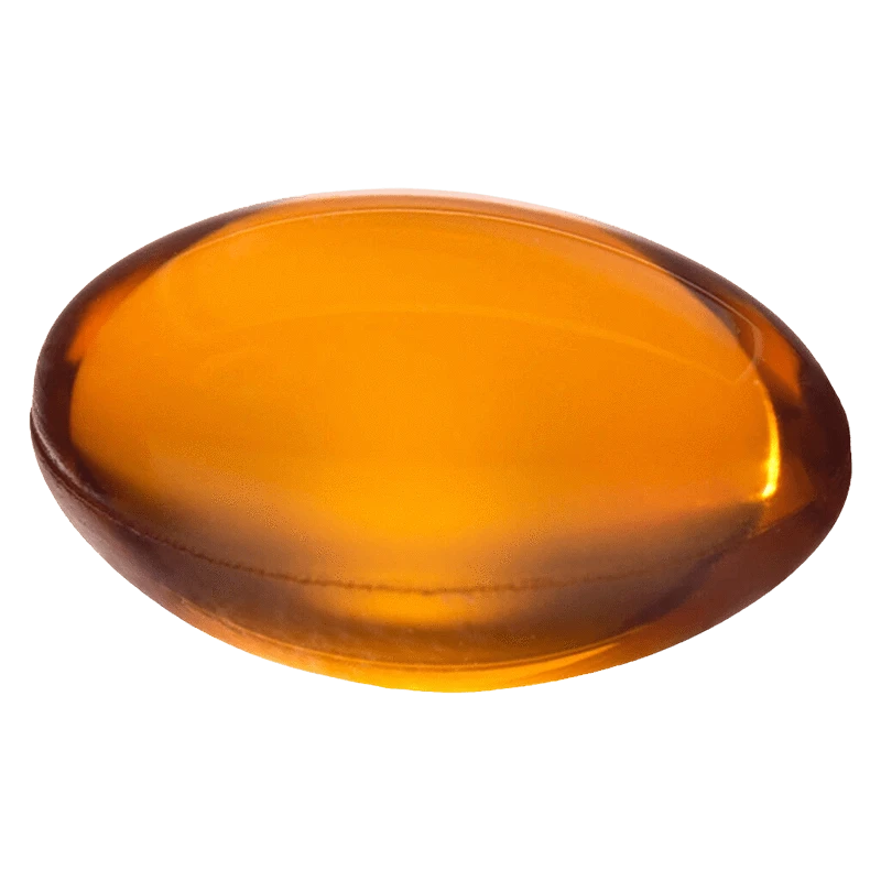 Top-down close-up of a glossy amber softgel labeled Mega Packs Bal THC:CBD 1:1, shown against a plain white background.