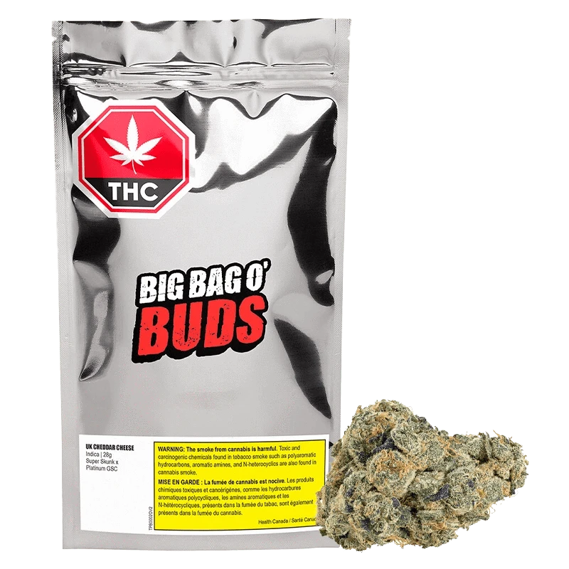 Close-up of the UK Cheddar Cheese packaging, featuring bold red and white typography on a dark background.