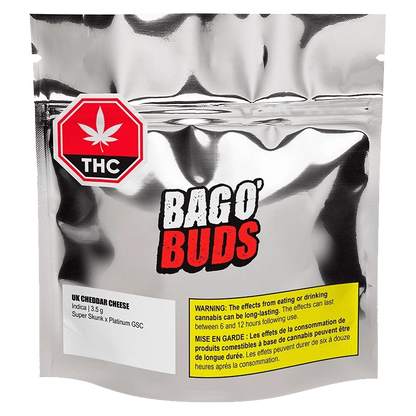 Front view of the UK Cheddar Cheese product packaging with bold text on a dark background.