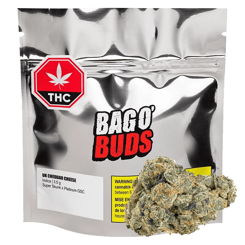 Front view of the UK Cheddar Cheese product packaging, featuring bold red lettering on a white background.