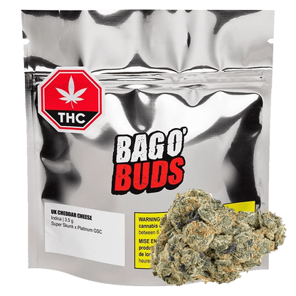 Front view of the UK Cheddar Cheese product packaging, featuring bold red lettering on a white background.