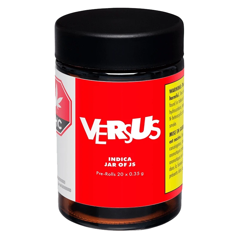 Front view of the Indica Jar of Js Pre Rolled 20 x 0.35 g, a cylindrical container with a reflective label, centered against a dark background.