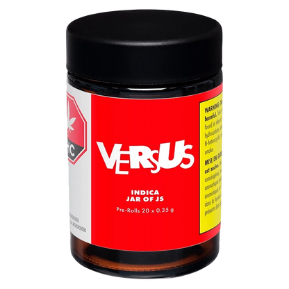 Front view of the Indica Jar of Js Pre Rolled 20 x 0.35 g, a cylindrical container with a reflective label, centered against a dark background.