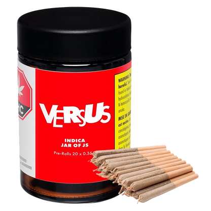 Close-up of the Indica Jar of Js Pre Rolled 20 x 0.35 g, showcasing its labeled container in a slightly angled, brightly lit shot.