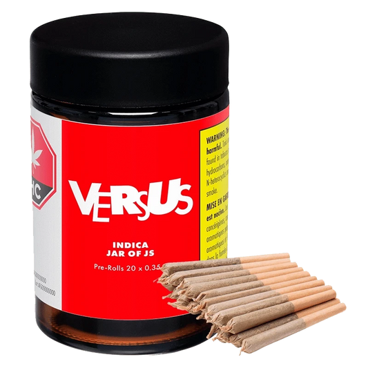 Close-up of the Indica Jar of Js Pre Rolled 20 x 0.35 g, showcasing its labeled container in a slightly angled, brightly lit shot.