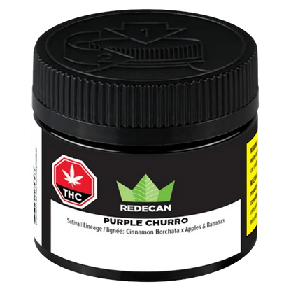 Close-up of the Redecan Purple Churro package, displaying bold branding against a dark background.