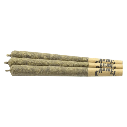 Close-up view of three Magic Pop RX Pre Rolled 0.5 g pre-rolls, arranged against a plain white backdrop.