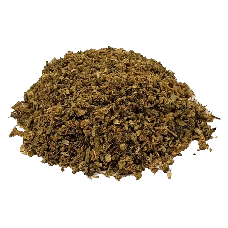 Overhead view of the Tropical Pack N’ Puff, showing a mound of vibrant green herbal blend against a white background.