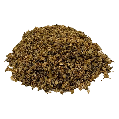 Overhead view of the Tropical Pack N’ Puff, showing a mound of vibrant green herbal blend against a white background.