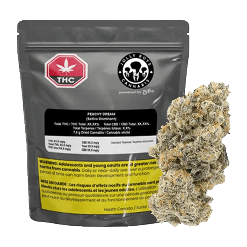 Close-up of the Peach Dream cannabis product packaging, showing bold lettering on a dark background.