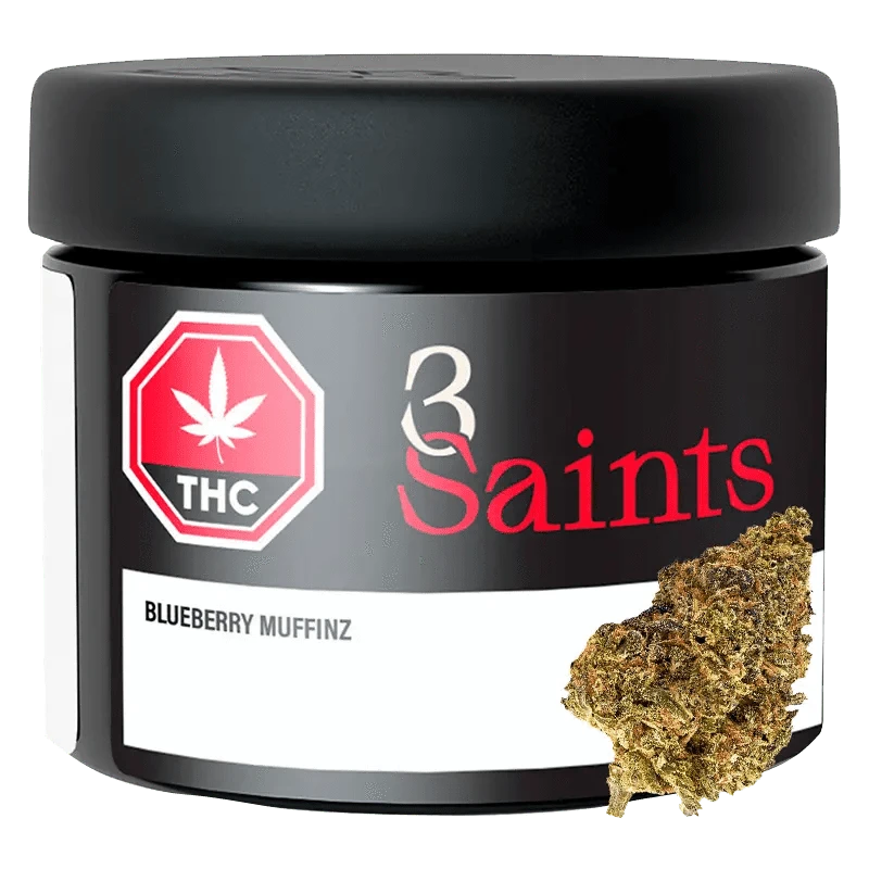 Close-up of Blueberry Muffinz, showing a pile of plant matter arranged in front of a dark, textured background.