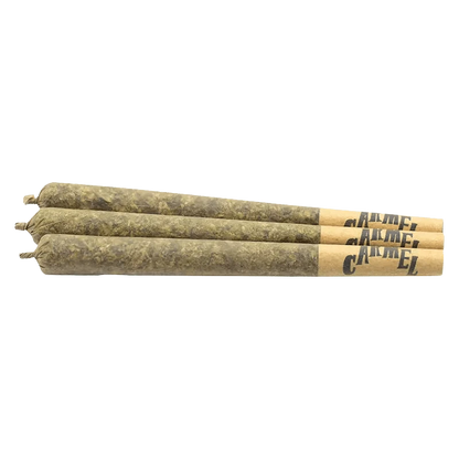 Overhead shot of three 0.5g containers of Permanent Cherries PR, showcasing the product's packaging on a plain white surface.