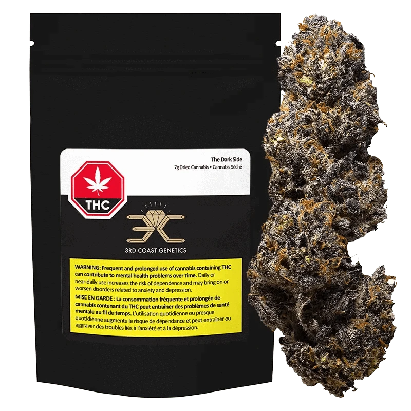 A close-up of “The Dark Side” dried cannabis with a white and green label, appearing as a dense, dark green bud.