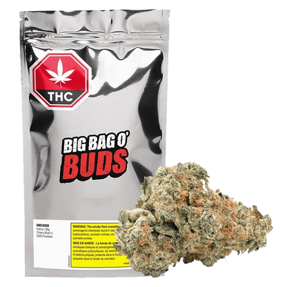 Front view of the GMO Kush package, featuring bold red lettering against a white background with visible warnings.