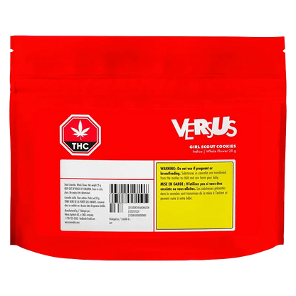 Rear view of the red VERSUS Girl Scout Cookies pouch with a white THC icon, barcode block, and yellow warning panel.
