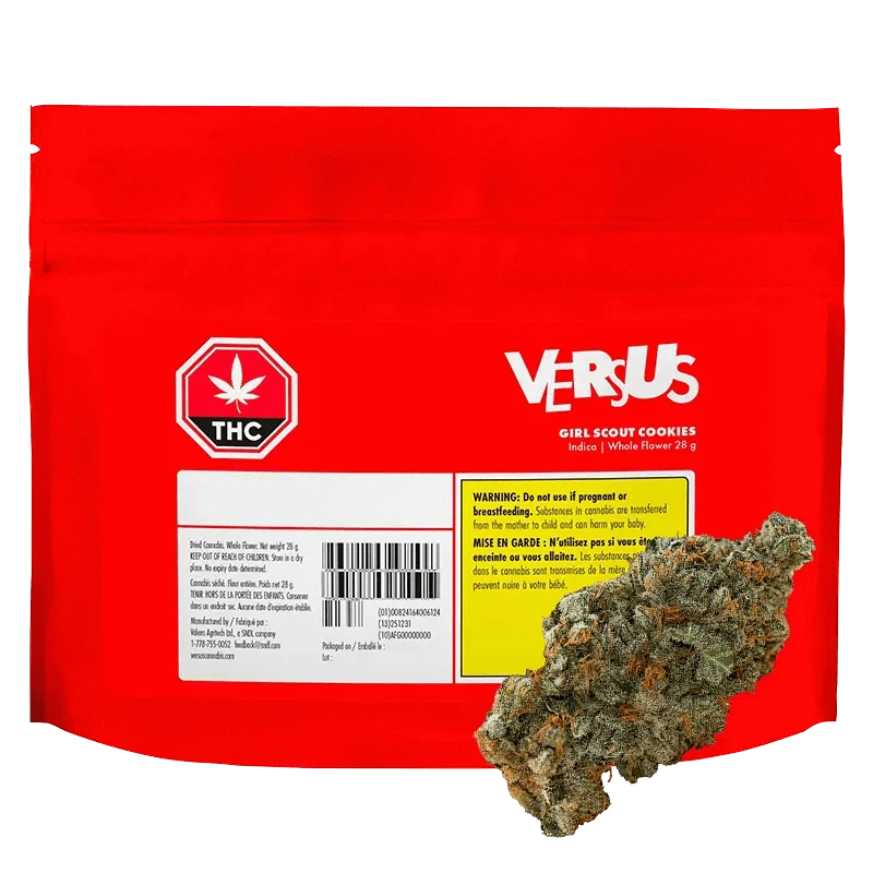 Front-facing red pouch labeled Versus Girl Scout Cookies with a cannabis bud resting against its lower right corner.