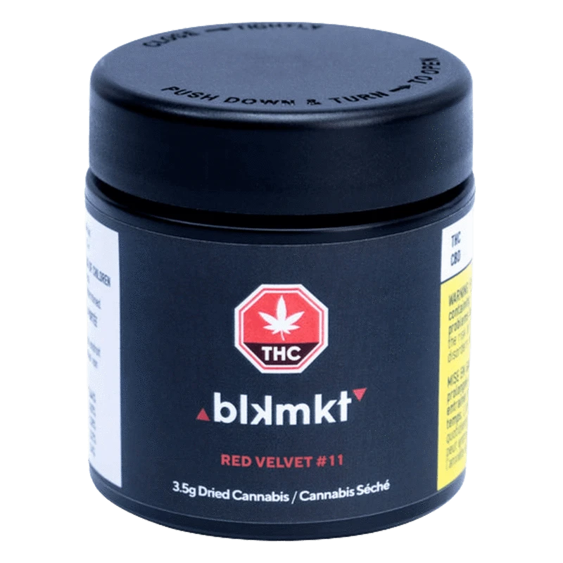 Front three-quarter view of the black blkmkt Red Velvet #11 jar with its childproof lid, THC emblem and red product text centered on the label.
