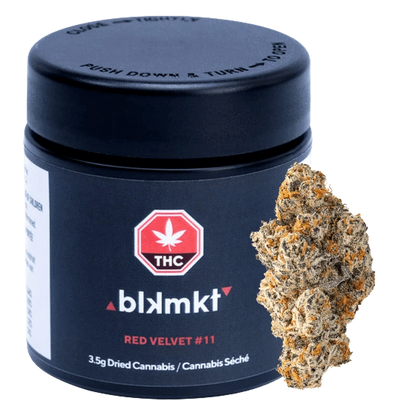 Front view of the black blkmkt Red Velvet #11 jar with THC logo and a close-up cannabis bud beside it.
