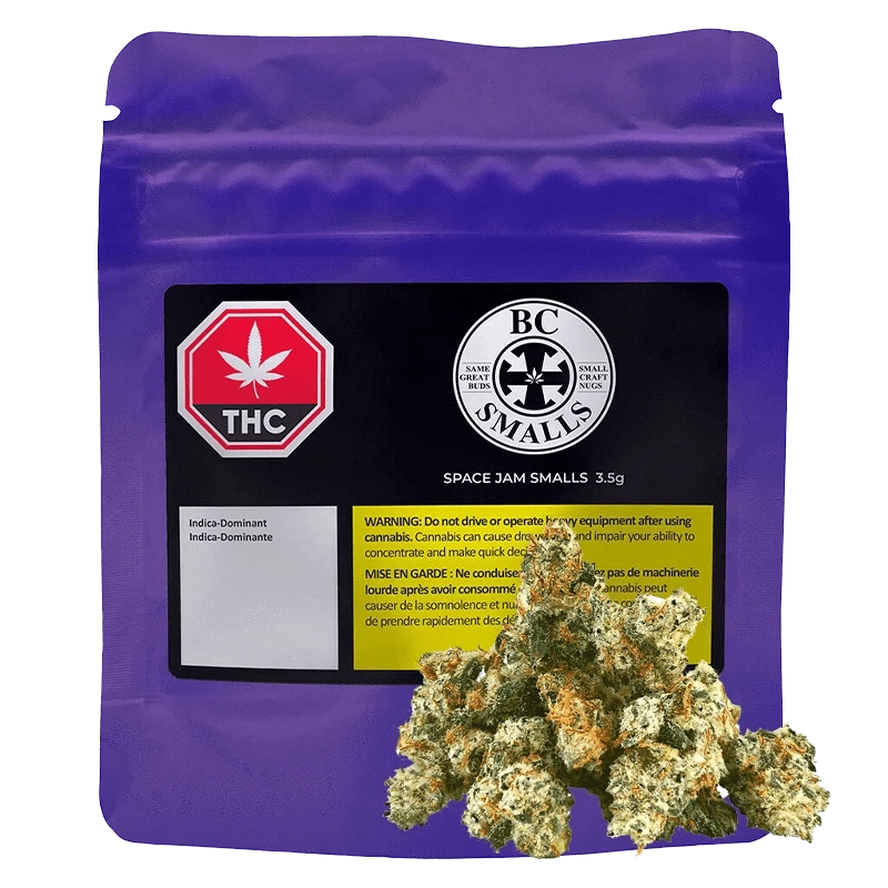 Front-facing shot of a purple pouch labeled Space Jam Smalls with a black and yellow warning panel and cannabis buds arranged at its base.