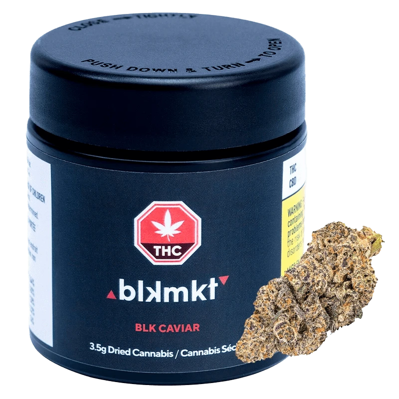 Front three-quarter view of the BLK Caviar black canister with red THC logo and a dried cannabis bud leaning against its right side.