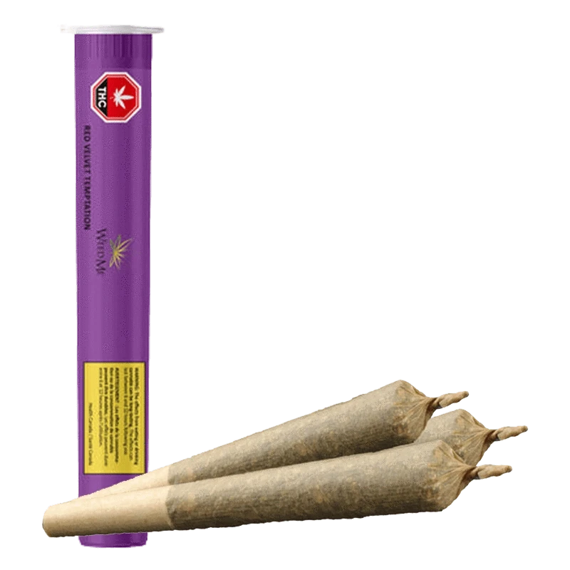 Vertical purple tube beside three brown cone-shaped prerolled joints in front, shown for Red Velvet Temptation PR 3 x 0.5 g.