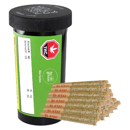 Three-quarter view of a black pill-style jar labeled Alien Gushers PR 20 x 0.5 g with a green label, shown beside a stacked pyramid of pre-rolled joints.