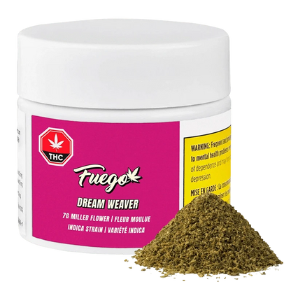 Front three-quarter view of a white jar labeled Fuego Dream Weaver with a magenta front label and a small pile of greenish milled flower in front.