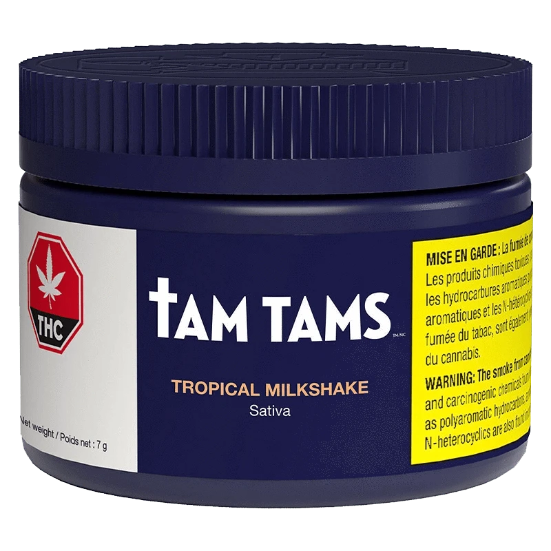 Front-facing shot of the Tam Tams Tropical Milkshake container in deep blue with bold white logo and bright warning labels.