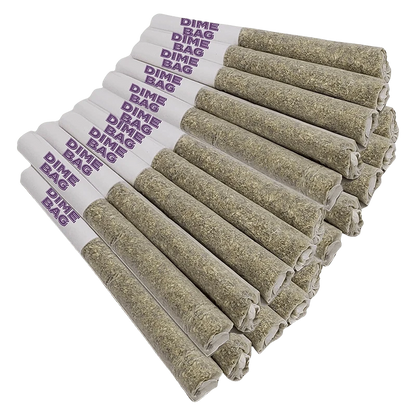 Angled close-up of a stacked row of Doozies Tropical Pocket Puffs PR 20 x 0.5 g pre-rolls with white purple‑stamped tips and tightly packed greenish herb ends.