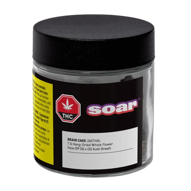 Front view of the clear jar labeled Soar Brain Cake showing a black lid, product label and a red THC symbol.