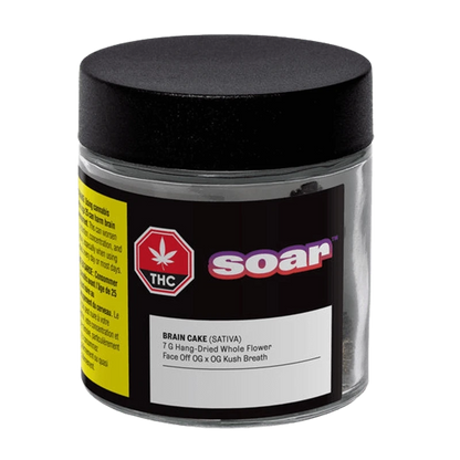 Front view of the clear jar labeled Soar Brain Cake showing a black lid, product label and a red THC symbol.